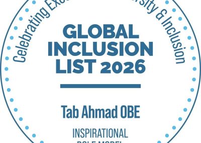 A circular digital badge with blue text on a white background. The text around the outer dotted border reads "Celebrating Excellence in Diversity & Inclusion". In the center, bold text says "GLOBAL INCLUSION LIST 2026" above a horizontal line, followed by the name "Tab Ahmad OBE" and the title "INSPIRATIONAL ROLE MODEL".